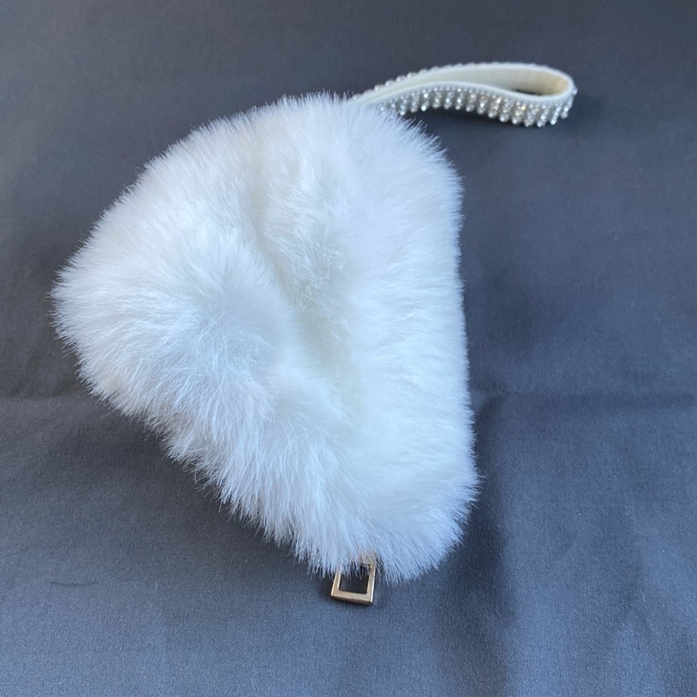 NWOT Mini fuzzy wristlet w/ storage & or bag charm.
